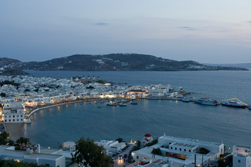 Greece, Mykonos, Hora. Evening view overlooking harbor.