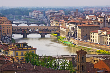 Fototapeta na wymiar Italy, Florence. Overview of city and Ponte Vecchio bridge over Arno River. 
