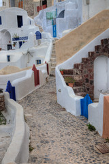 Greece, Santorini. Walkway in town of Oia with colorful gates