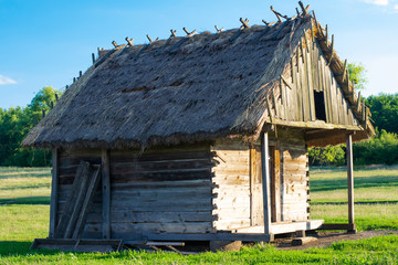 Fototapeta na wymiar Wooden traditional house. The houses of peasants of the 16th century