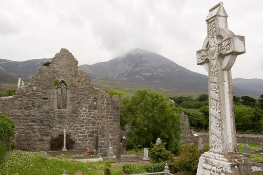 Ireland, County Mayo, Murrisk. Ruins and cemetery of Murrisk Abbey with Croagh Patrick, The Holy Mountain, seen in the distance.