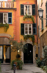 Fototapeta na wymiar Italy, Santa Margherita Ligure. Inviting courtyard of a decorated building.