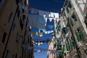 Italy, Venice. Laundry strung between buildings in the Ghetto.