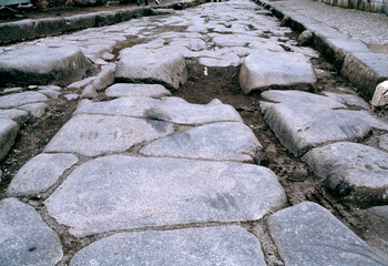 Italy, Pompeii. The ruts of chariots are still visible at Pompeii, a World Heritage Site, Italy.