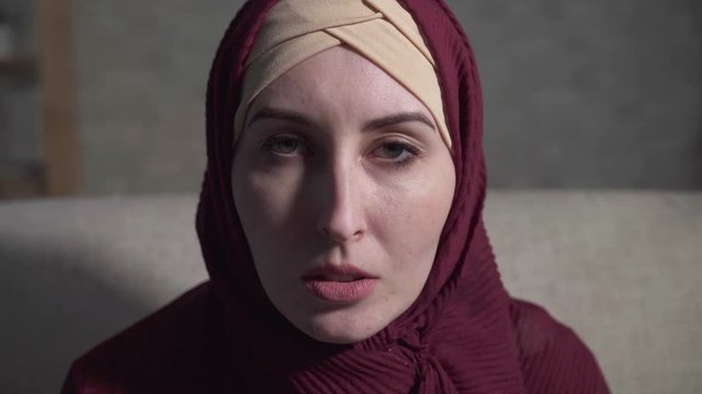 Portrait of a crying young muslim woman