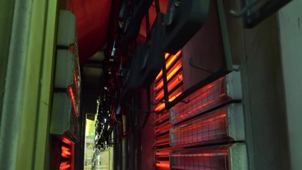 Production workshop for drying painted parts of the oven on a conveyor belt