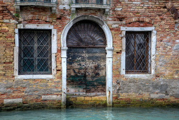 Old and colorful doorways and windows in Venice Italy