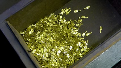 metal aluminum, copper wire tips fall into the basket of the manufacturing machine