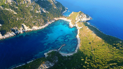 Aerial drone photo of iconic paradise bay of Porto Timoni with tropical deep blue and turquoise clear sea, Corfu island, Ionian, Greece