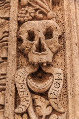 Italy, Bari, Apulia, Monopoli. Roman Catholic church entrance. Door and arch detail. 'Memento Mori'...