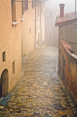 Italy, Montepulciano. Foggy and wet street. Credit as: Jim Nilsen / Jaynes Gallery / DanitaDelimont.com