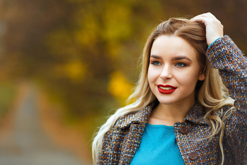 Stylish woman in autumn park