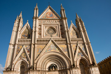 Fototapeta na wymiar Italy, Umbria, Orvieto. The Cathedral of Orvieto or Duomo of Orvieto. 13th century Gothic masterpiece, thought to be one of the best Gothic buildings in Italy. Detail of front facade..