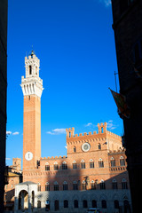 Obraz premium Sienna, Tuscany, Italy - Low angle view of an old world building with tower.