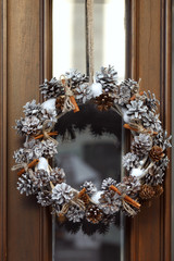 Christmas wreath hanging on a door