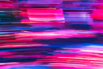 Colorful red, blue and purple light trails with motion blur effect, long time exposure, background and wallpaper