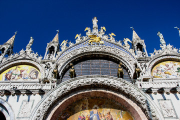 Venice, Italy. Front of Saint Mark's Basilica with bronze horses and Saints
