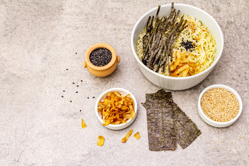 Noodles with seaweed, tuna flakes and sesame seeds