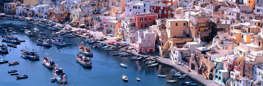 Italy, Procida. The homes and the boats are painted lively colors in Corricella on the Isle of Procida near Naples, Italy.