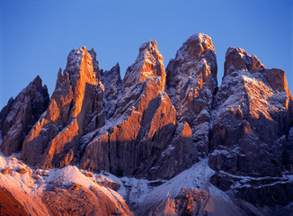 Fototapeta na wymiar Italy, Odle Group. Late light rests on the craggy, snow-dusted peaks of the Odle Group, in the Dolomite Alps, Italy.