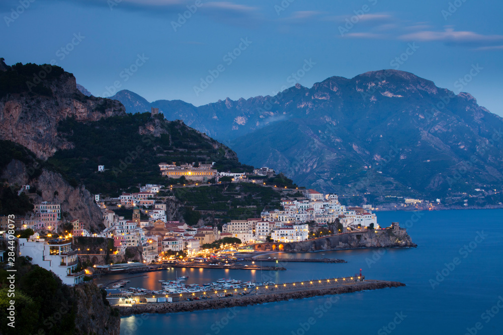 Poster Evening light on the harbor and town of Amalfi.