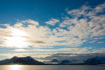 Norway. Svalbard. Spitsbergen. Forlandsundet. High clouds and midnight sun.