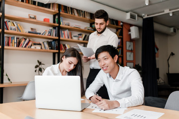 office workers doing business project together