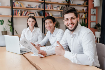 happy office workers at workplace doing job together
