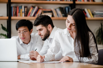 group of office workers men and woman working together