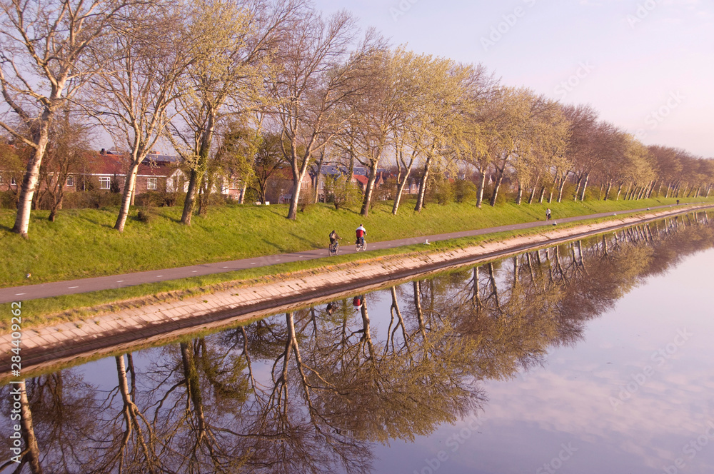 Poster the netherlands (aka holland), zeeland, middelburg. early morning views of the dikes that surround t