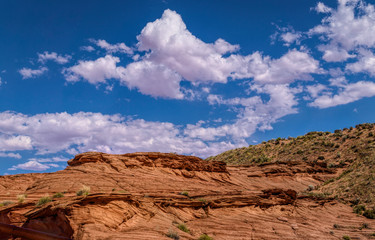 Fototapeta na wymiar Arid landscape of Arizona. The crumbling sandstone mountains and blue sky