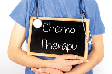 Doctor shows information on blackboard: chemo therapy.  Medical concept.