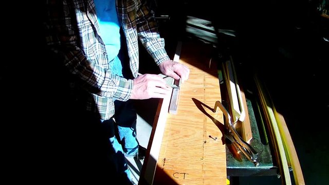 Person Marks Wood For Cutting Using Framing Square