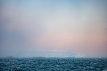 Fototapeta premium Norway, Svalbard, Kvitoya. Glacier in fog at sunrise. Credit as: Josh Anon / Jaynes Gallery / DanitaDelimont.com