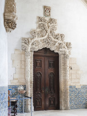 Door with typical mantellone decoration in the church. The monastery of Alcobaca, Mosteiro de Santa Maria de Alcobaca (UNESCO World Heritage Site). Portugal.