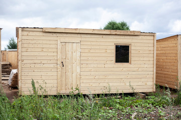 Change house from the boards. Temporary housing for workers. Wooden product. House for the cottage.