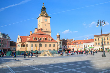 Fototapeta na wymiar Romania, Brasov, Council Square, Piata Sfatului, fountain in square.