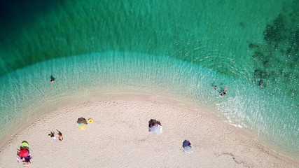 Aerial drone photo of tropical exotic island sand bar separating sea in two with turquoise and sapphire breathtaking colours © aerial-drone