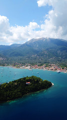 Aerial drone bird's eye view photo of iconic port of Nidri or Nydri a safe harbor for sail boats and famous for trips to Meganisi, Skorpios and other Ionian islands, Leflkada island, Ionian, Greece