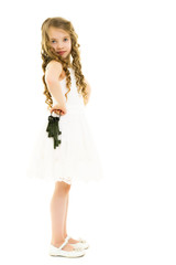 Little girl is holding keys to the door.