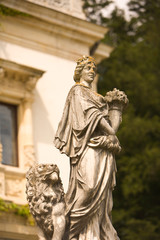 Romania, Sinaia. Stone statues at 19th Century Peles Castle. 