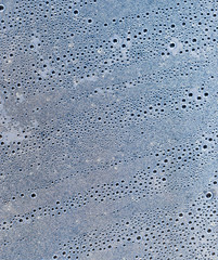 Background of the condensate drops on the film is polyethylene. Water drops texture