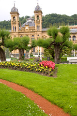 Fototapeta premium Spain, San Sebastian. Popular seaside resort, park view of historic casino.