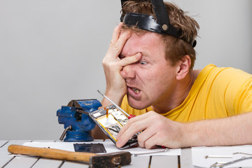 Man repairing cell phone