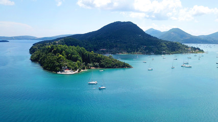 Aerial drone bird's eye view photo of iconic port of Nidri or Nydri a safe harbor for sail boats and famous for trips to Meganisi, Skorpios and other Ionian islands, Leflkada island, Ionian, Greece