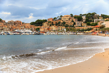 Spain, Balearic Islands, Mallorca, Port of Soller, harbor, historical waterfront, shops, beach.