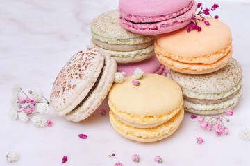 Few colored macarons on a white background