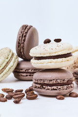 Few colored macarons on a white background