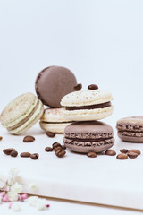 Few colored macarons on a white background