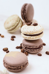 Few colored macarons on a white background